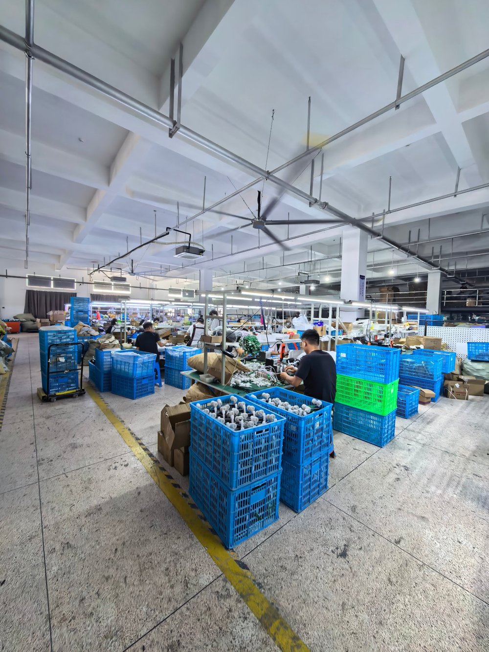 Massage device assembly line - workers at production stations